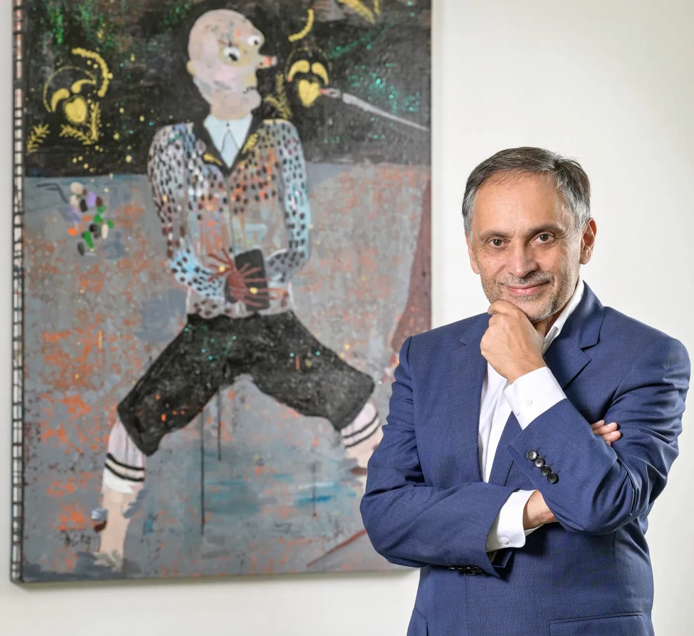 Portrait of Christophe Gaillard, founder of Galerie Christophe Gaillard, standing in front of a painting